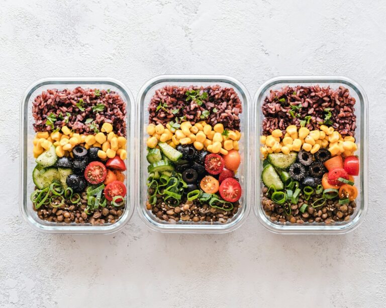 Meal prep containers holding colourful vegetables.